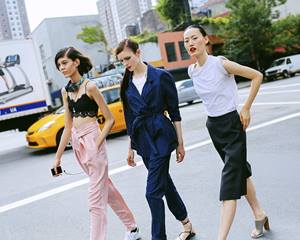 Three beautiful women walking the streets of New York City. 